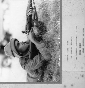 Photograph, Mervyn Lloyd Hunt of Linton, competing in rifle shooting competition, 1935