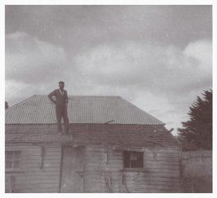 Photograph, Cameron Ching on roof of Ching brothers' home