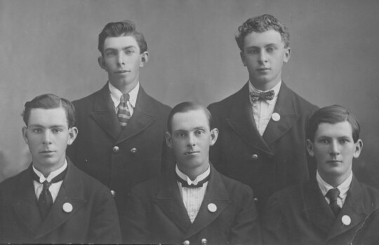 Portrait of five men.