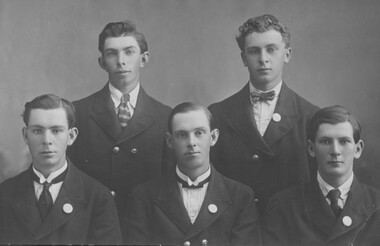 Portrait of five men.