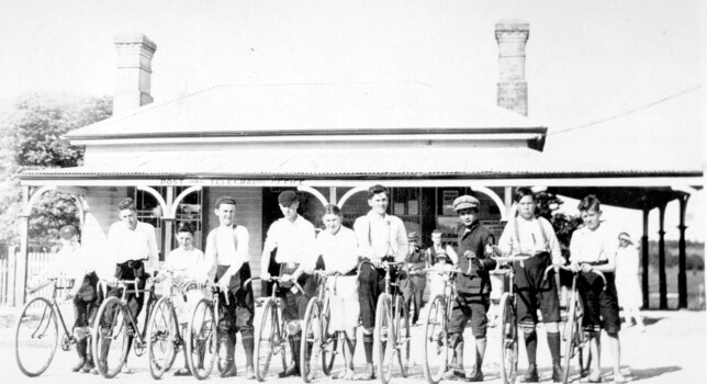 Group of boys with bicycles.