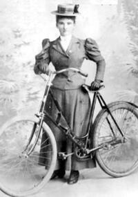 Woman with a bicycle.