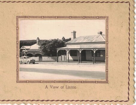 Car and buildings on a Christmas card.