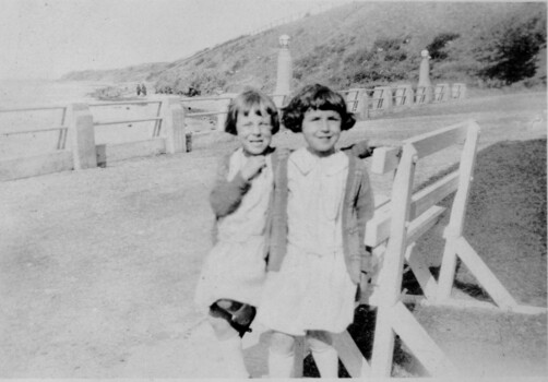 Twin sisters at the seaside.