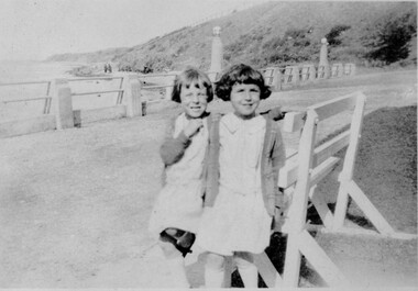 Twin sisters at the seaside.