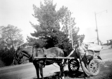 Man with horse drawn cart.