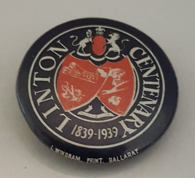 Badge celebrating a centenary.