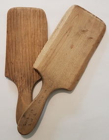 Pair of wooden butter pats.