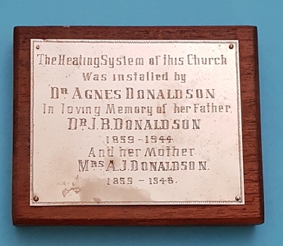 Engraved dedication plaque.