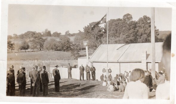 Men at a ceremony.