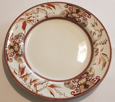 Decorative, round dinner plate.