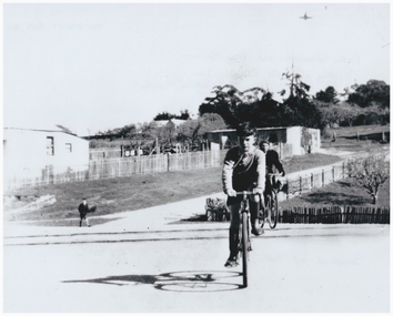 A Boy and girl riding bicycles.