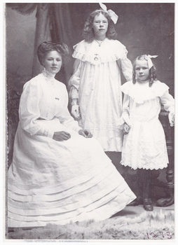 Portrait of a woman and two girls.