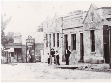 Buildings and people on a street.