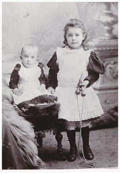 Portrait of a young girl and a baby.