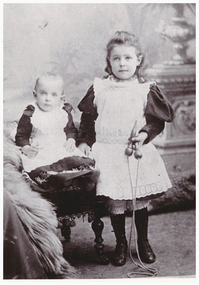 Portrait of a young girl and a baby.