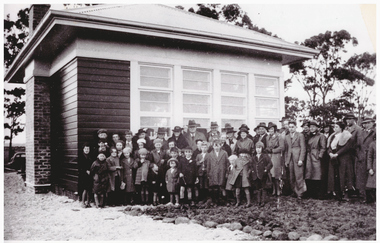 School pupils outside a building.