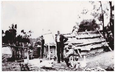 Two men at a mining site.