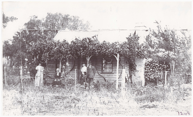 People in front of a house.