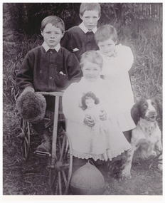 Image of four children and a dog.