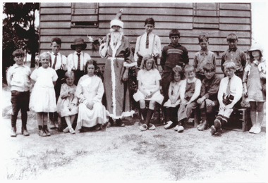 School students and teachers celebrating Christmas.