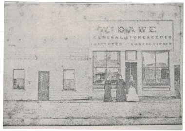 People in front of a shop.