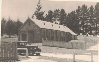 Car parked outside a Parish Hall.