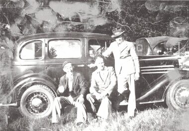 Three men and a car.