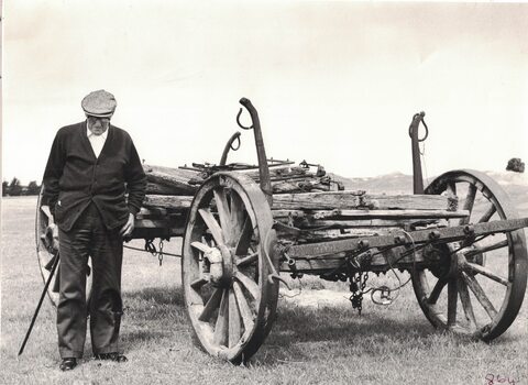 Man next to a wagon.