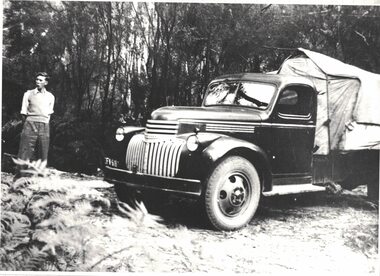 Man standing near a truck.