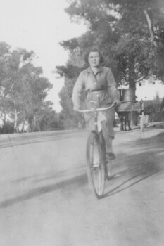 Woman riding a bicycle.