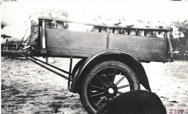 Cart with dead rabbits inside.