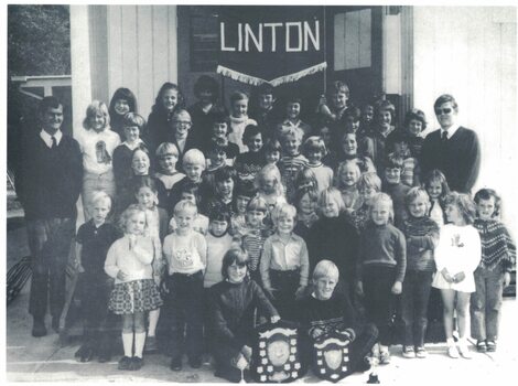 Group of pupils, teachers and trophies.