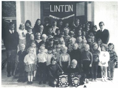 Group of pupils, teachers and trophies.