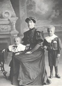 Portrait of a woman with two young boys.