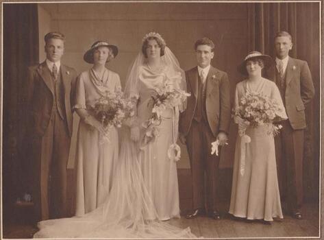 Four people of a wedding party.