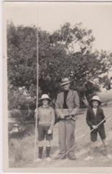 A man and two boys going fishing and hunting.