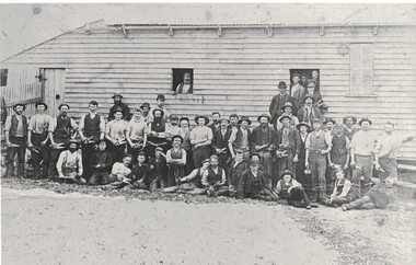 Men outside a woolshed.