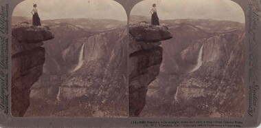 woman standing on an outcrop.