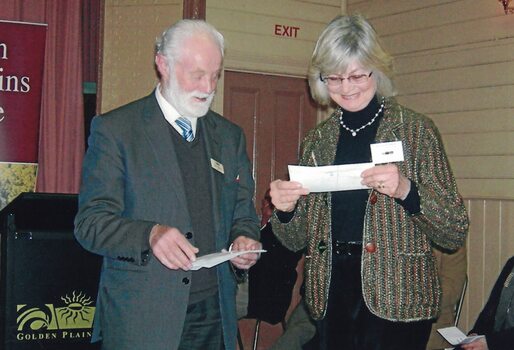 Man making a presentation to a woman.