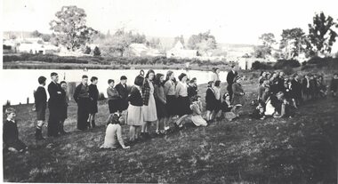 Group of children planting trees.