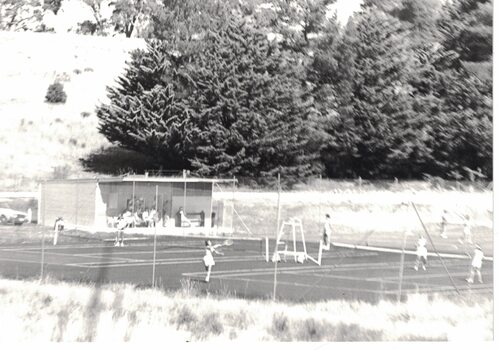 People playing tennis.