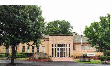 Image of a cream brick building.