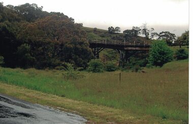 Image of a trestle bridge over a creek.