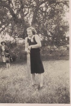 Image of a woman playing cricket.