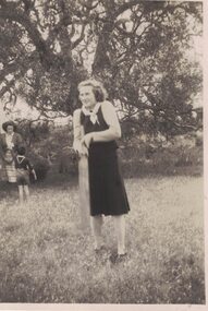 Image of a woman playing cricket.