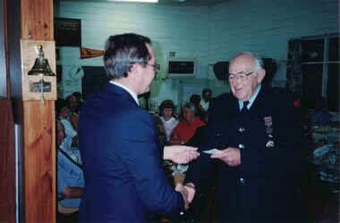 Image of a man receiving an award.