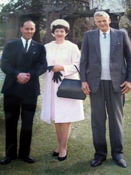 Image of two men and a woman.