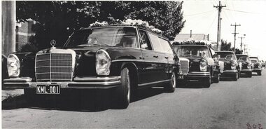 Image of funeral cars.