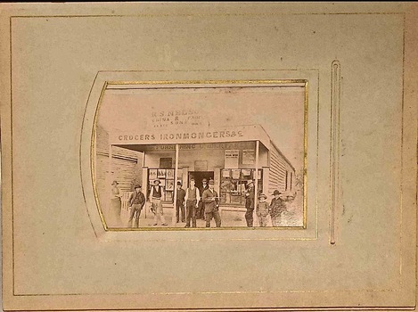 People in front of a shop.